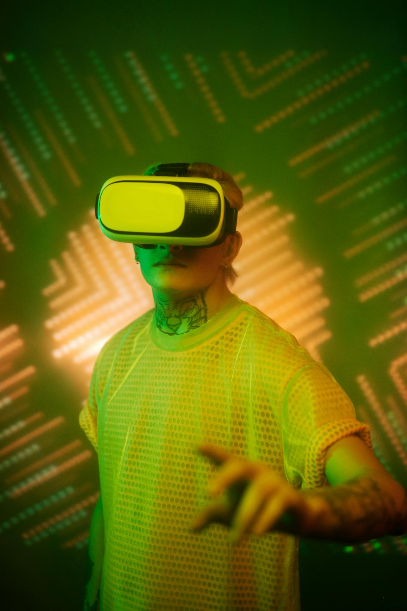 A man wearing VR goggles immersed in a vibrant virtual reality environment.